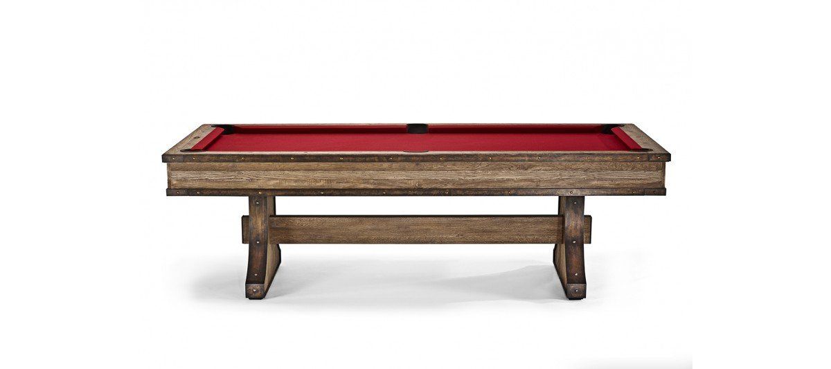 Red felt pool table with wooden frame and legs on a white background