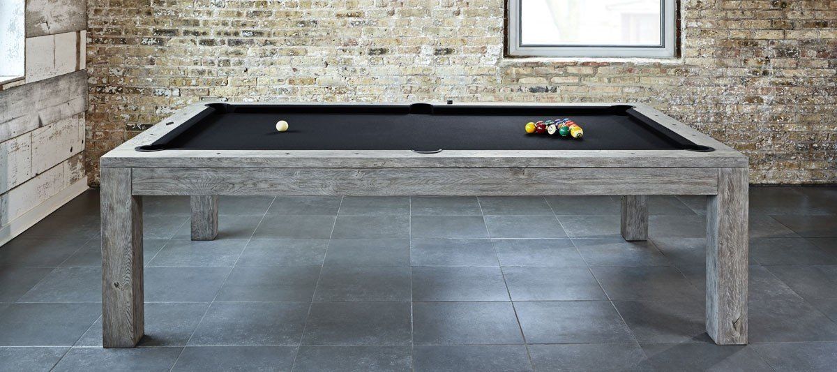 Outdoor concrete pool table with balls on a patio