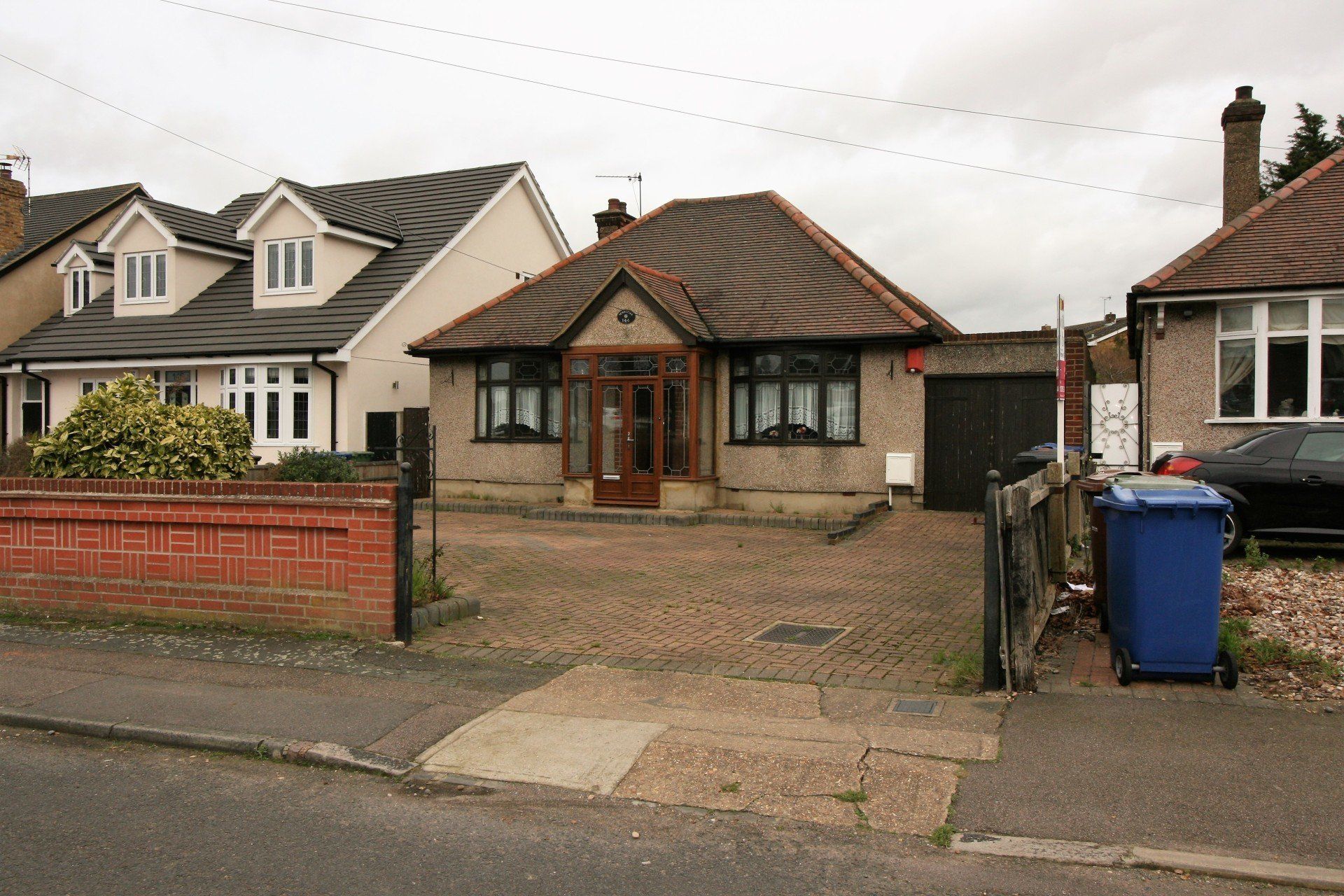 Paved driveway with shrub area, garage door, UPVC porch leading to the front wooden door   Hallway - 5.93 x 1.1 Carpet, wallpapered walls, double radiator, artex ceiling, light socket   Bedroom One - 3.68 x 3.64 Wooden door leading into the bedroom, carpet, wallpapered walls, wooden lead? bay window, fitted wardrobes, double radiator, smooth ceiling, light fitting    Double doors leading to the en-suite - 1.35 x 1.63 Tiled floor, white W/C, white handbasin, tiled walls, heated towel rail, tiled shower cubicle with shower and seat, extractor fan, smooth ceiling, spot lights   Bedroom 2 - 3.68 x 3.36 Wooden door leading to bedroom 2, carpet, wallpapered walls, wooden bay window, radiator, smooth ceiling, light fitting    Bedroom 3/Reception 2 - 3.68 x 2.86 Wooden door leading into room,, wallpapered walls, chimney with open fireplace, lead window, double radiator, smooth ceiling, light fitting, double doors leading onto the lounge   Lounge - 4.55 x 3.44 Carpet, wallpapered walls, double radiator, smooth ceiling, light socket, lead framed double doors leading onto the garden   Bathroom - 2.49 x 2.00 Wooden door leading into the bathroom, part tiled floor and part carpet, cream W/C, cream handbasin, cream corner bathroom with mixer taps, tiled walls, radiator, sliding doors to storage area, wooden windows, artex ceiling, light fitting    Kitchen - 3.41 x 2.52 Wooden door leading to the kitchen, tiled floor, low and high fitted units, gas hob, fitted oven and grill, single fridge and freezer, single sink and drainer, tiled walls, artex ceiling, light fitting, wooden window and door leading onto the garden   Utility room leading off the kitchen - 1.41 x 3.41 Tiled floor, double radiator, fitted low and high cupboards, fittings for a washing machine, single sink, wooden window, tiled walls, boiler, artex ceiling, light fitting    Garage - 5.08 x 2.09 concrete floor, brick walls, tiled roof   Garden - 29.08 x 12.12 Patio area with raised sleeper beds, summer house, mature trees and shrubs in the grass area