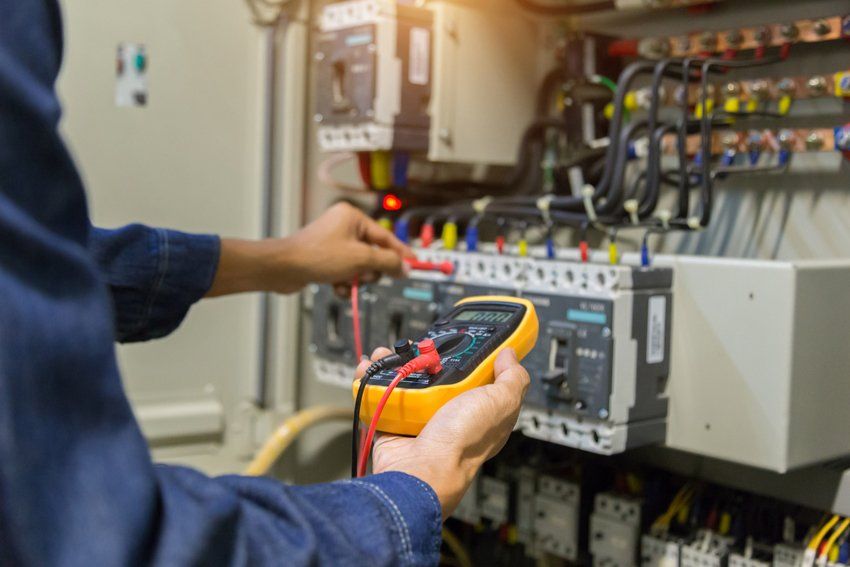 Electrician Measuring Voltage Power Electric Line — Mansfield, OH — Thomas Electric