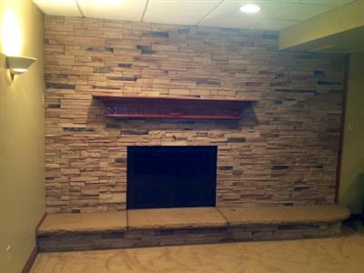 There is a fireplace in the middle of the room.