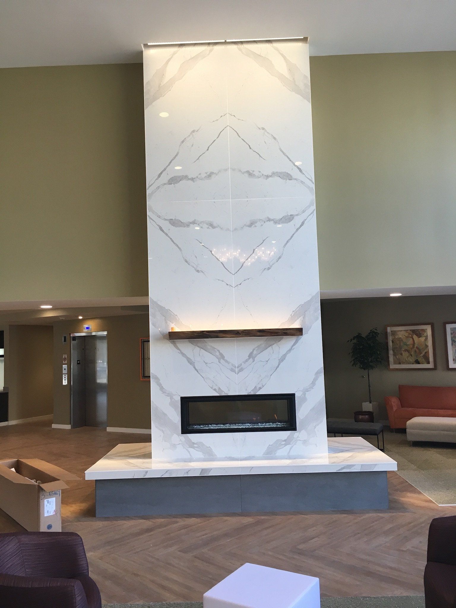 There is a fireplace in the middle of the room.