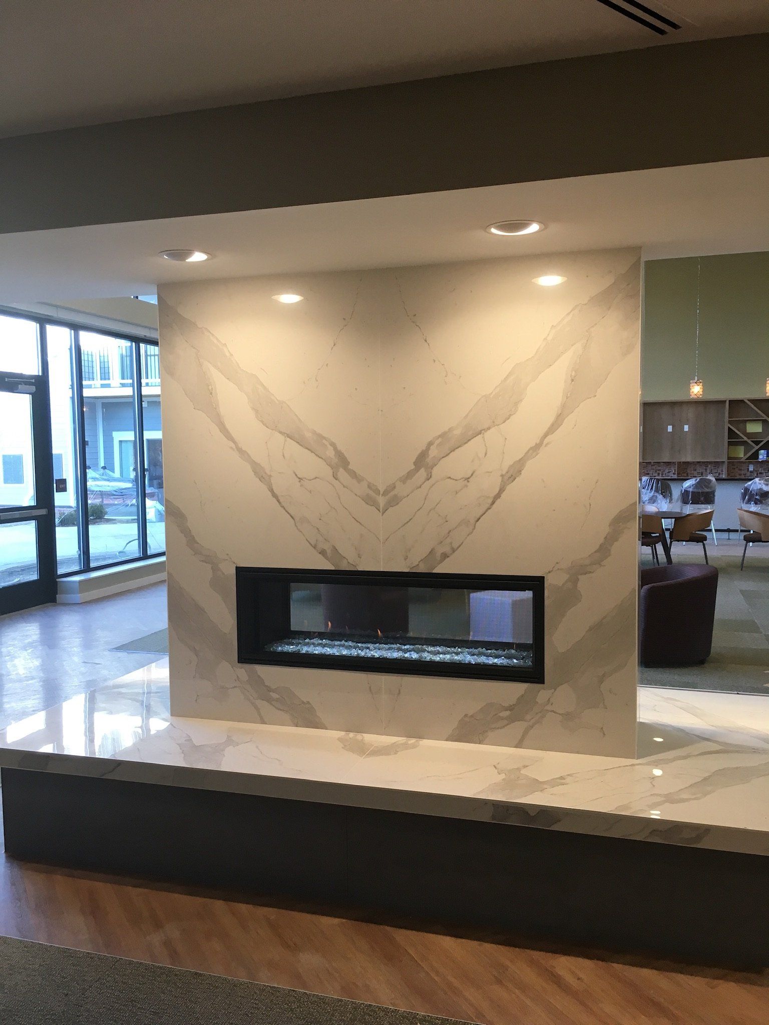 There is a fireplace in the middle of the room.