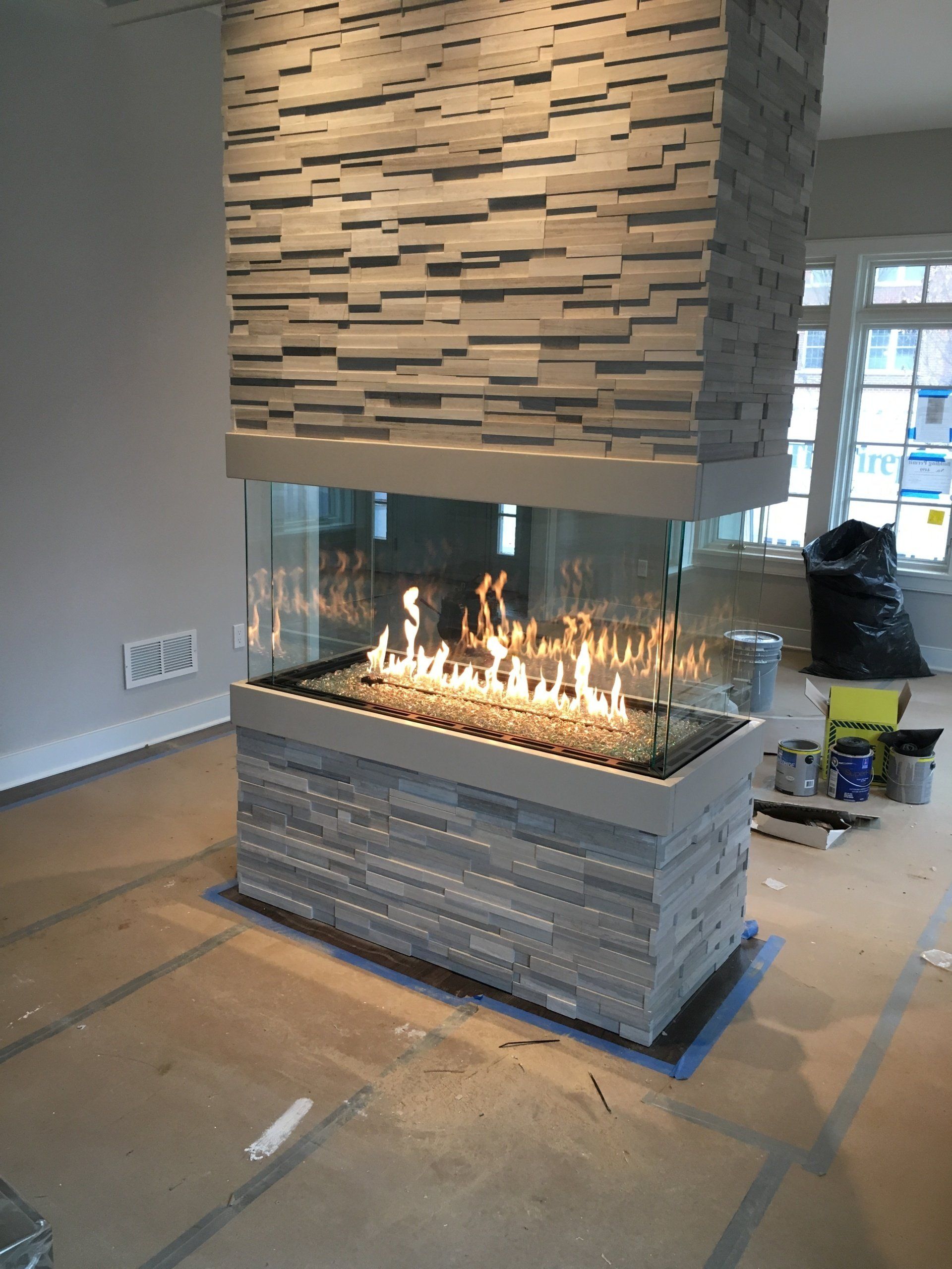 There is a fireplace in the middle of the room.
