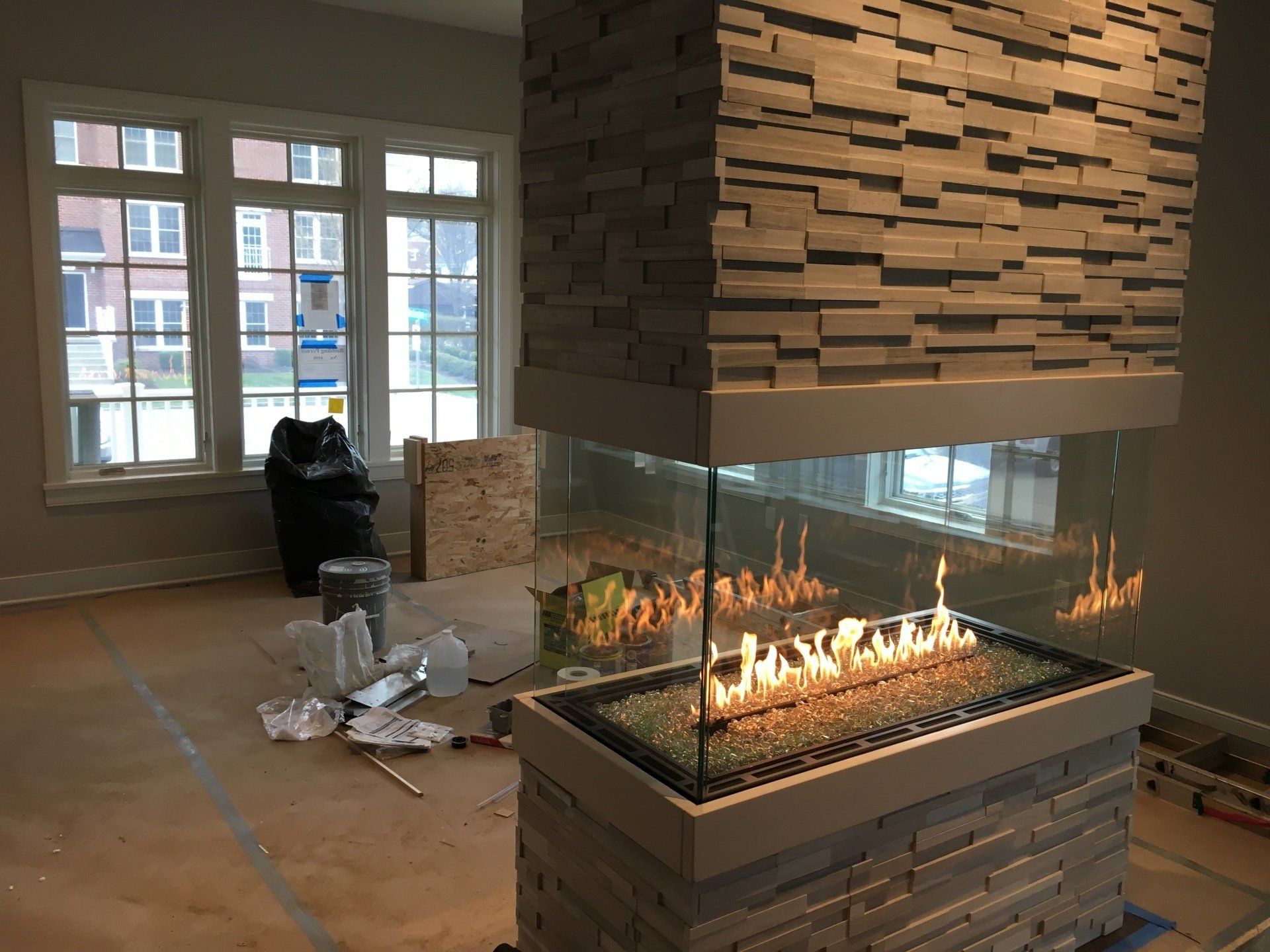 There is a fireplace in the middle of the room.