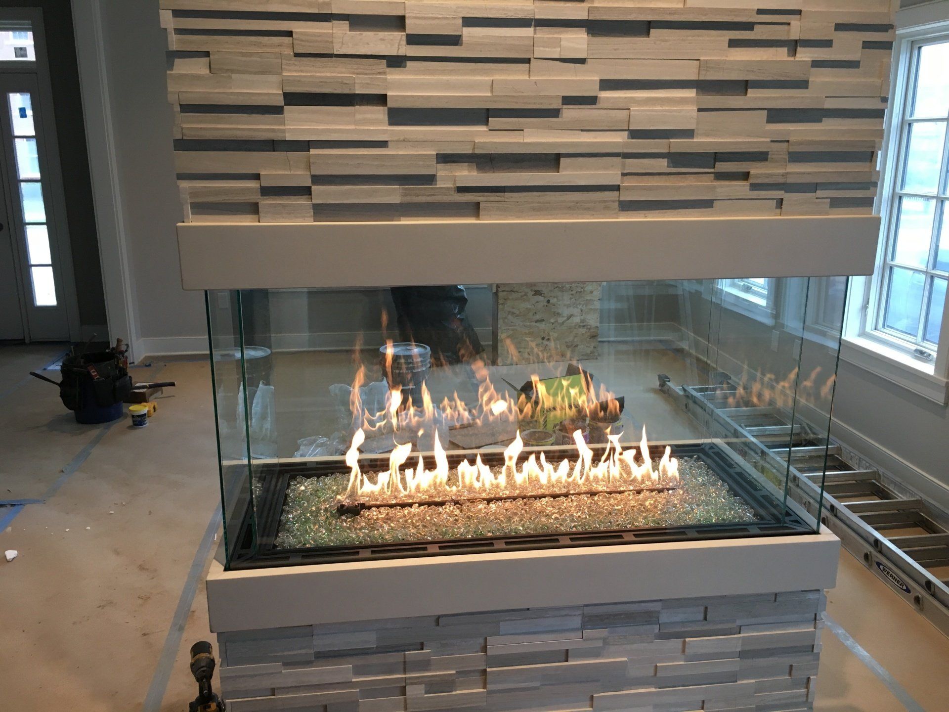There is a fireplace in the middle of the room.