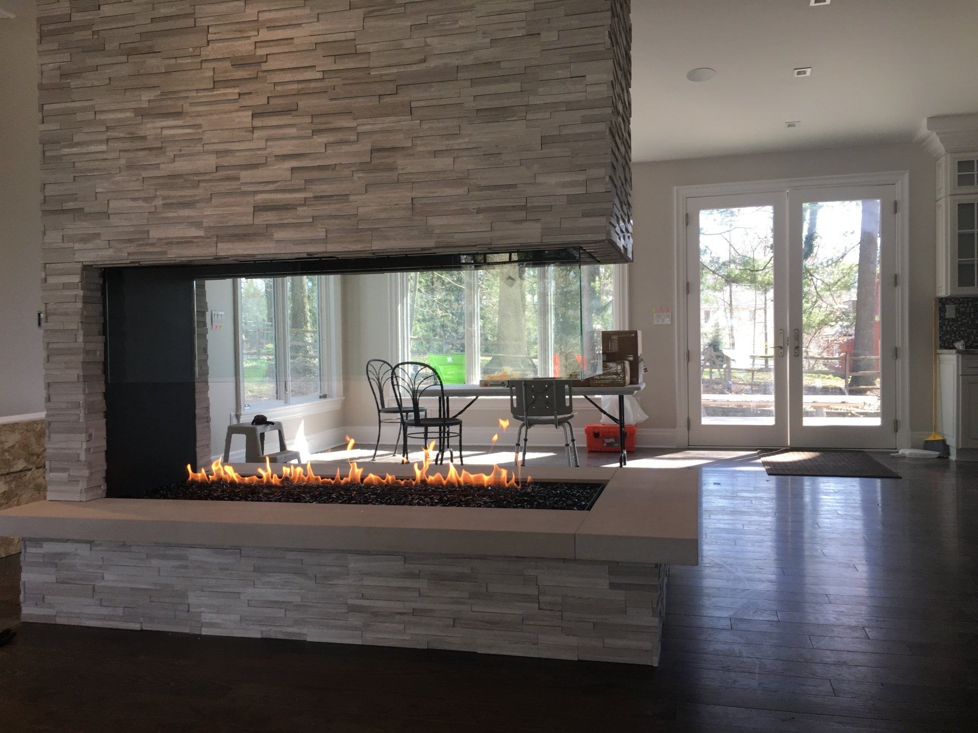 A living room with a fireplace and sliding glass doors