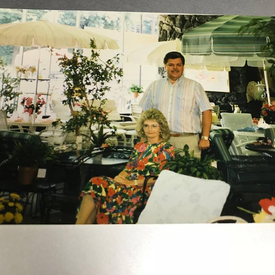 A man and a woman are posing for a picture