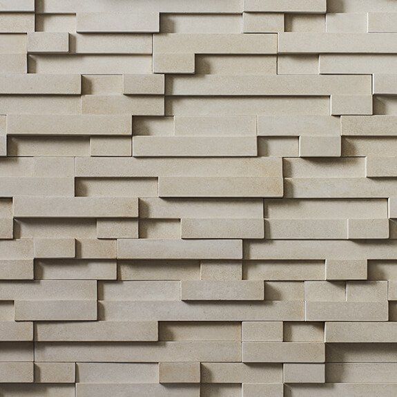 A close up of a brick wall with a geometric pattern