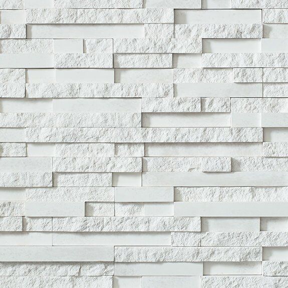 A close up of a white brick wall.