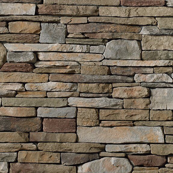 A close up of a stone wall with many different types of rocks