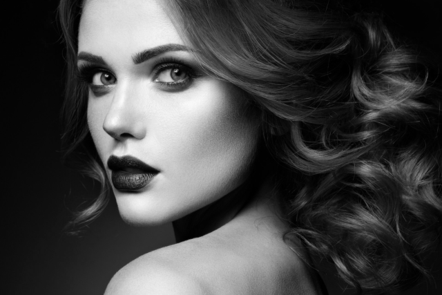 A black and white photo of a beautiful woman with long hair.