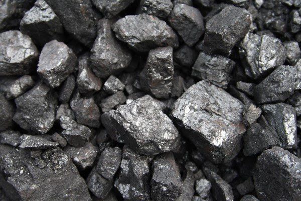 A pile of coal is sitting on top of each other on a table.