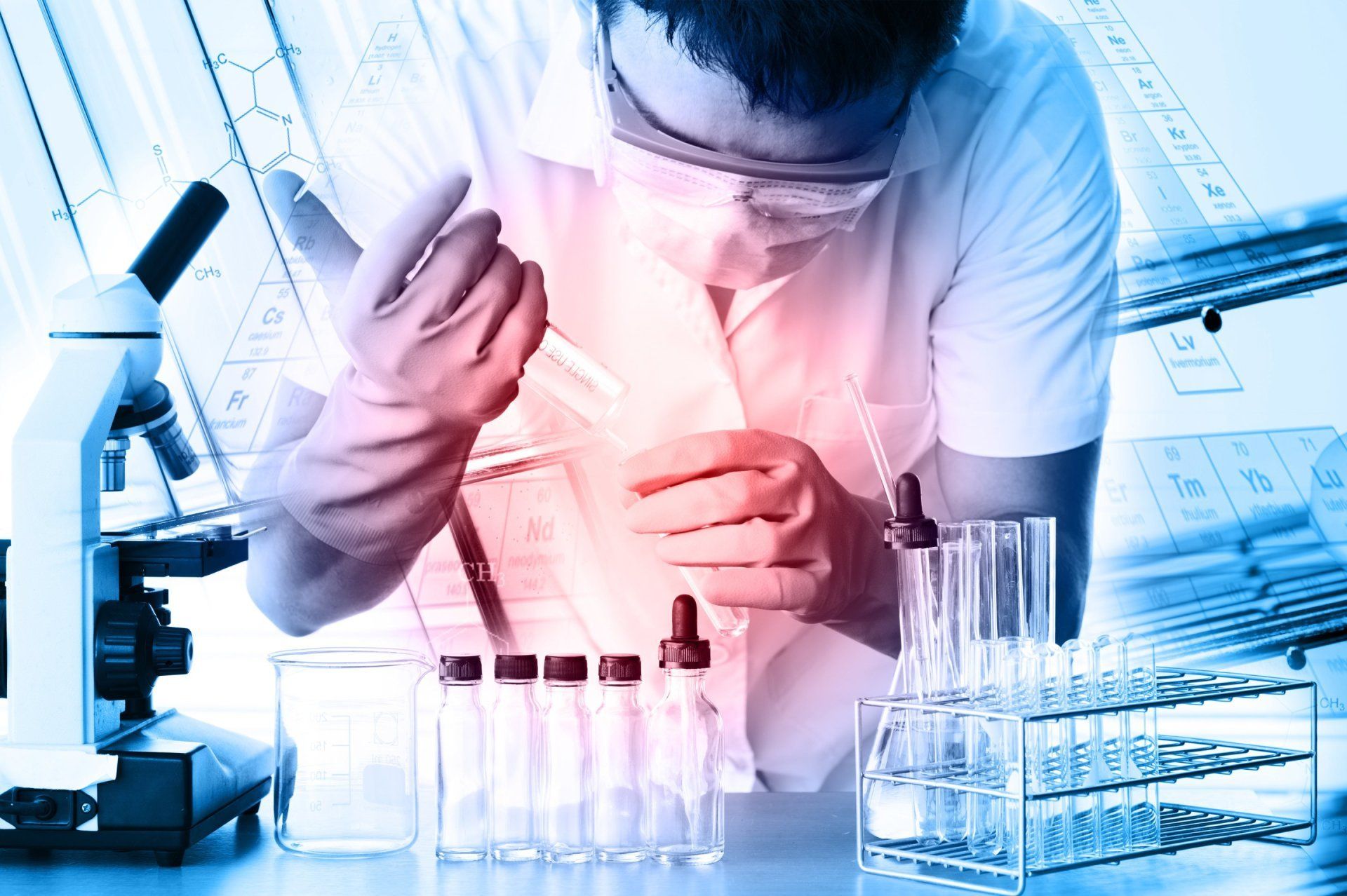A scientist is looking through a microscope in a laboratory.