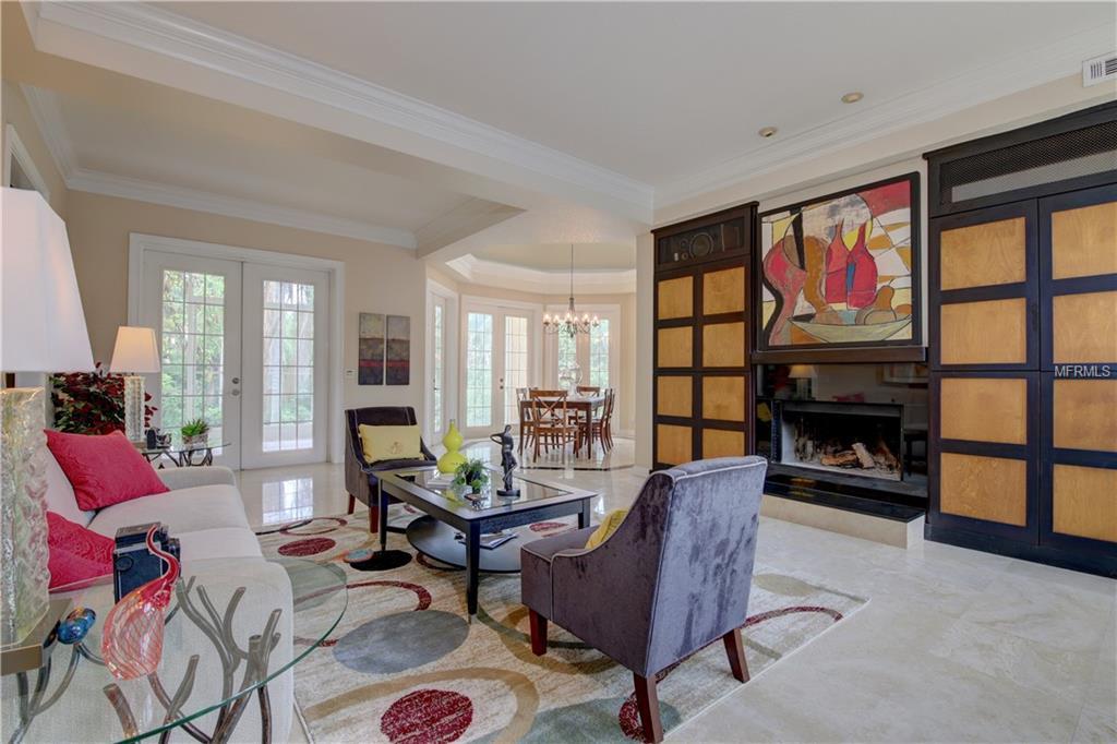 A living room filled with furniture and a fireplace.