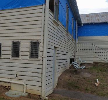 Side of commercial building being repaired side of commercial building being repaired