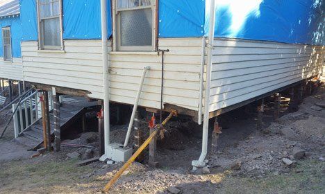 Home being raised and repaired home being raised and repaired