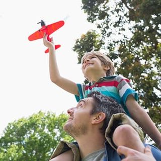 Father Carrying His Son — Life Insurance in Bozeman, MT