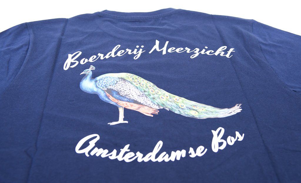Blue t-shirt with a peacock design and the text 