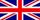 De Britse vlag (Union Jack). Een rood, wit en blauw ontwerp met diagonale en verticale kruisen.
