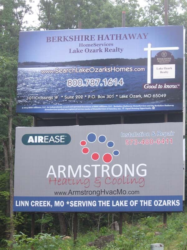 a large billboard advertising berkshire hathaway and armstrong