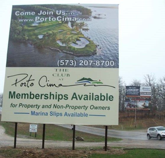 a billboard for the porto cima club advertises memberships available for property and non-property owners
