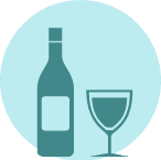  A bottle of wine beside a full glass