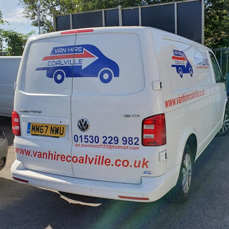 Small white van featuring the company logo