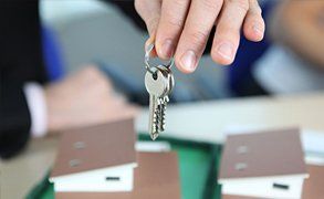 A man holding a set of keys