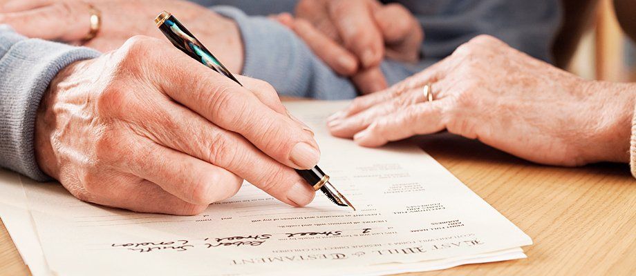 A close up of a document being signed