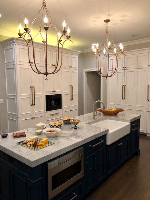 A kitchen with a large island and a sink