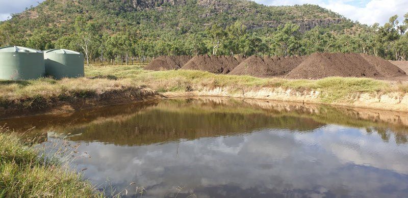 dry landscape of brush next to water