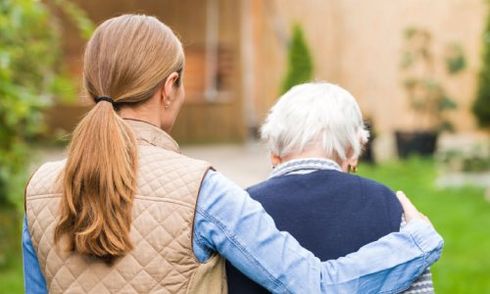 young women taking care of an old lady