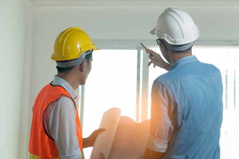Contractor discussing about the window
