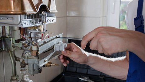an engineer offering boiler repairs
