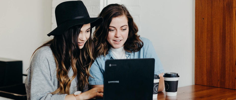 Two girls clicking around on the internet Two girls clicking around on the internet