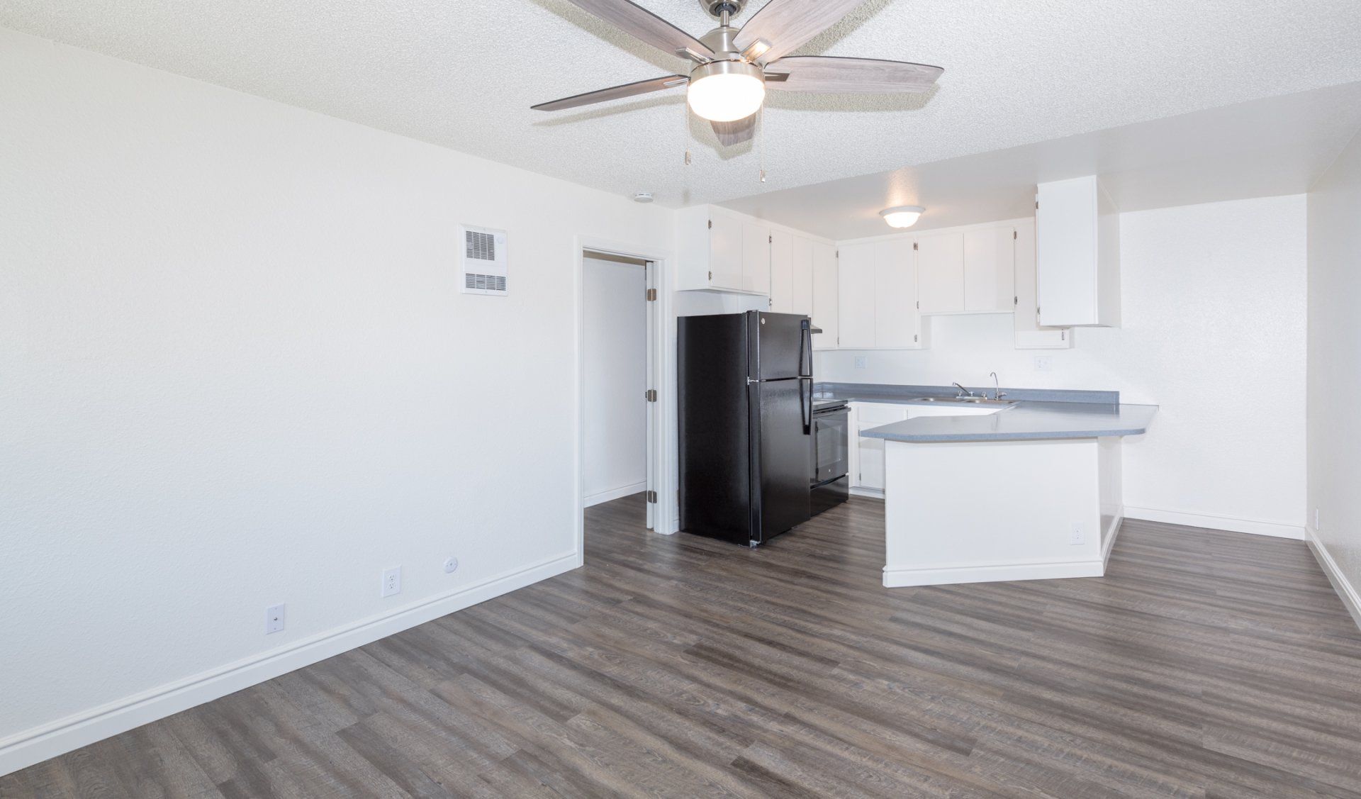 Unfurnished kitchen and living areas