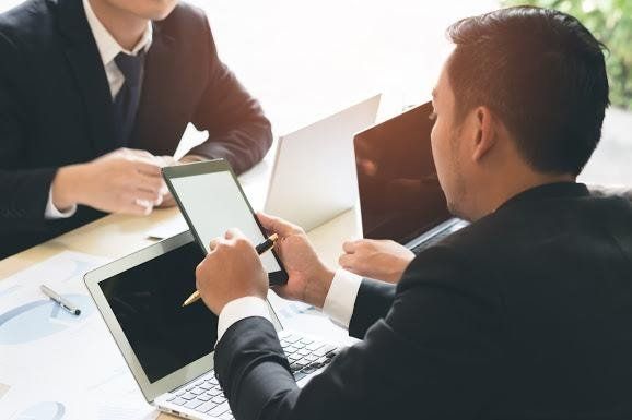 Attorney Holding His Tablet — Birmingham, AL — Allen D. Arnold Attorney at Law