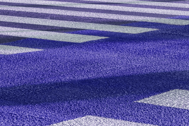 A close up of a purple and white crosswalk.