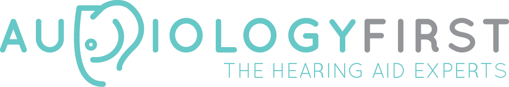 A logo for audiology first the hearing aid expert