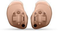 A pair of hearing aids on a white background.