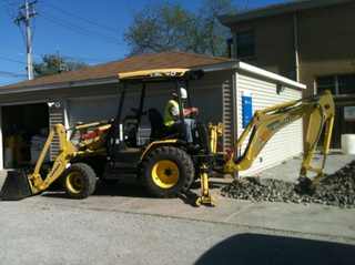 Man digging with an excavator Man digging with an excavator