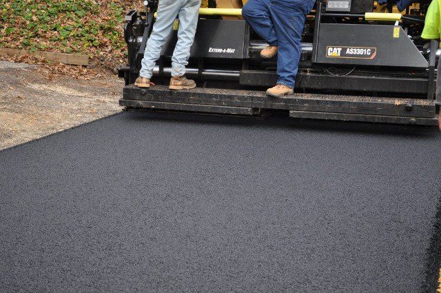 Two Men on Paver Machine — Kent, WA — Acme Paving & Seal Coating, Inc.