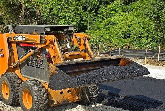 Excavator Repairing a Road — Kent, WA — Acme Paving & Seal Coating, Inc.