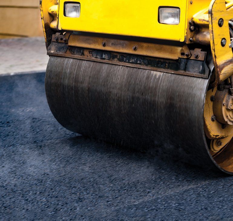 Asphalt Driveway — Compact Steamroller Flatten Out The Asphalt In Kent, WA Asphalt Driveway — Compact Steamroller Flatten Out The Asphalt In Kent, WA