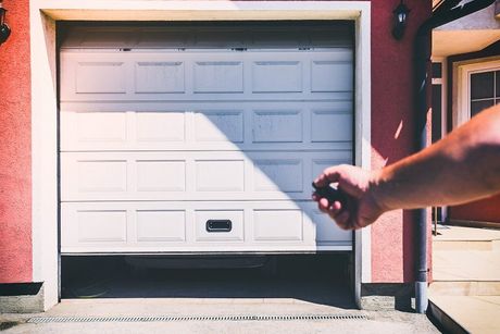 Garage Door Installation — Modern New White Garage With Roller Shutter in Signal Hill, CA