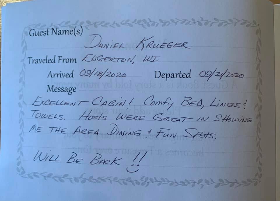 Handwritten guest note on white paper with decorative border, thanking a visitor and saying they’ll be back.