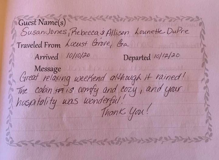 Handwritten guest note on pink paper with names, travel dates, and a thank-you message.