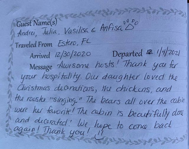 Handwritten guestbook note thanking hospital staff, with Christmas gift bags and candy canes in the background
