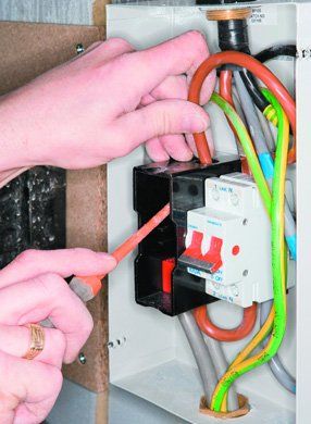 Electrical services - Palgrave, Norfolk - electrician working on an electrical fuse box - DAVID PEACHEY ELECTRICAL AND MECHANICAL Electrical services - Palgrave, Norfolk - electrician working on an electrical fuse box - DAVID PEACHEY ELECTRICAL AND MECHANICAL